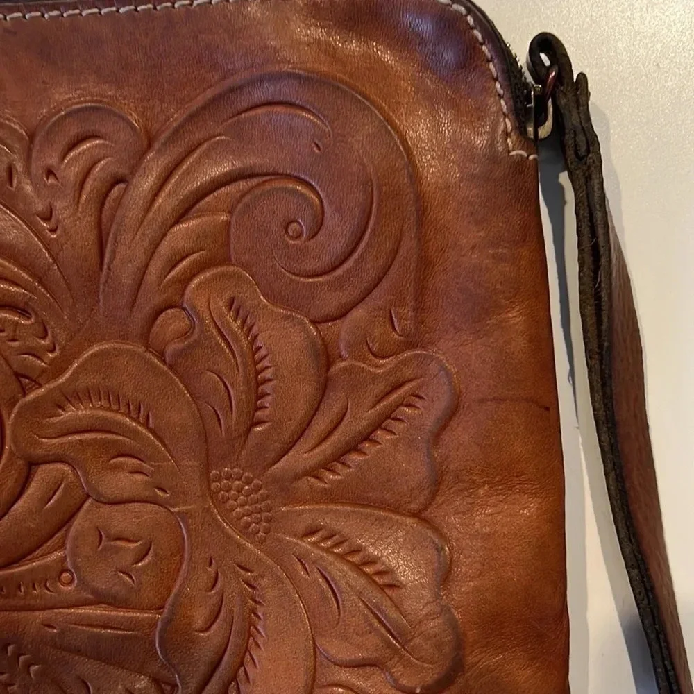 Patricia Nash Cassini Wristlet with tooled floral pattern in Florence Brown